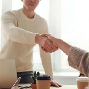 Two people are handshaking