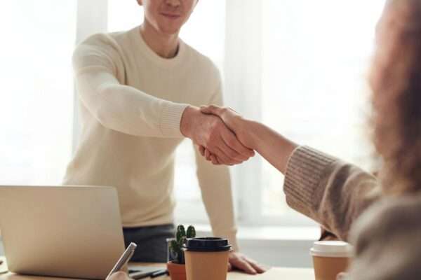 Two people are handshaking